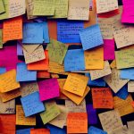 board filled with post it notes