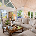 living room with tan couches and wood coffee table