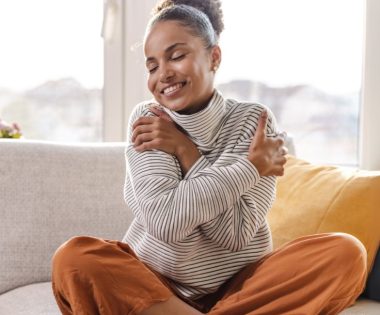 woman hugging herself - selfcompassion