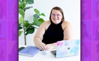 a woman sitting at a desk-Sammy Bohannon