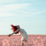 a woman embraces summer slow living