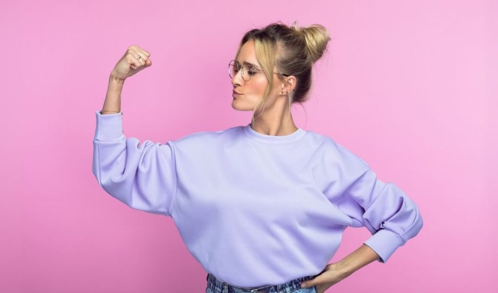 confident introvert - woman making a fist