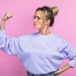 confident introvert - woman making a fist