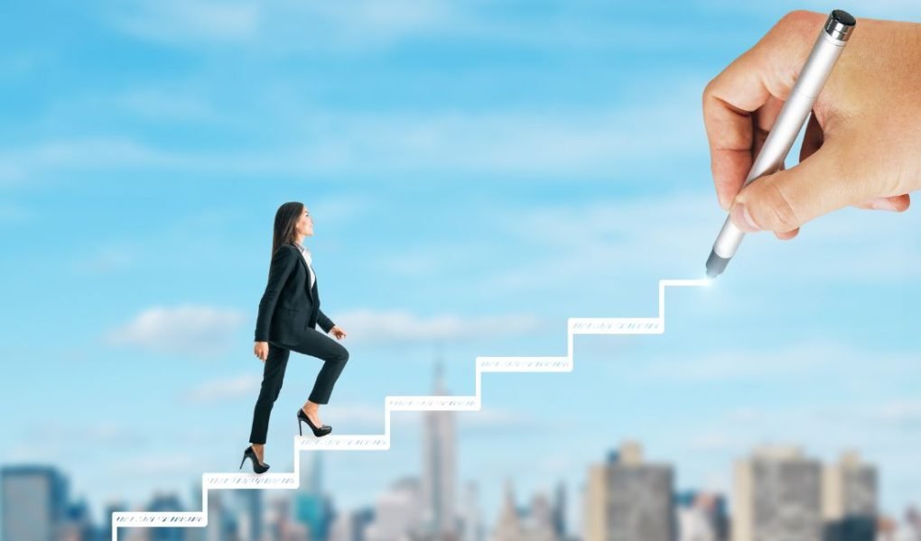 woman walking up stairs - career motivation tips