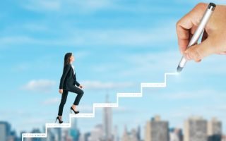 woman walking up stairs - career motivation tips