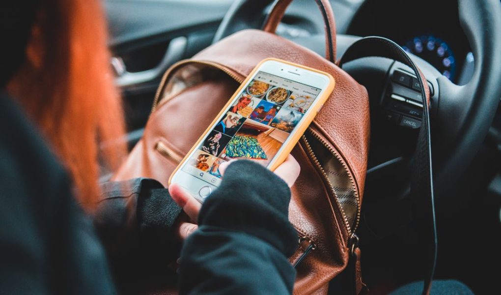 woman scrolling on phone -marketing without social media