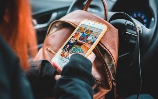 woman scrolling on phone -marketing without social media