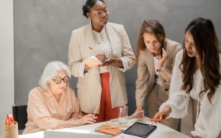Women discussing - quiet leadership at work