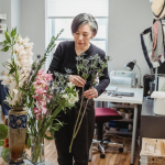 a woman utilizing florals for an easy home refresh