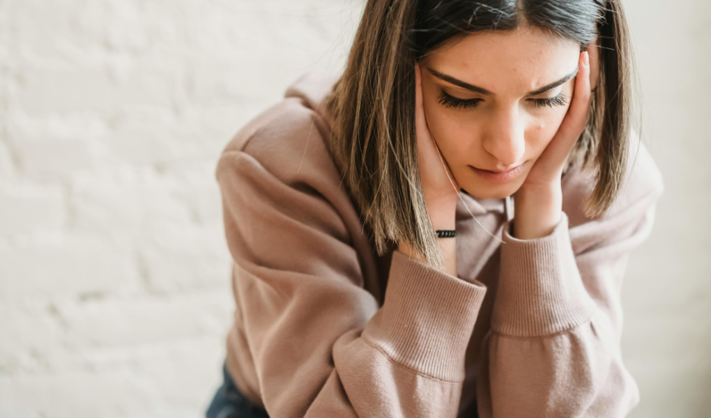 A woman experiencing imposter syndrome at work