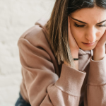 A woman experiencing imposter syndrome at work