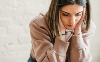 A woman experiencing imposter syndrome at work