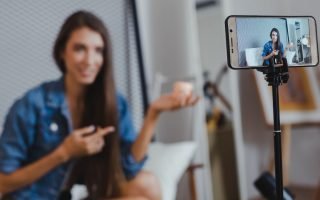 woman talking to phone camera marketing for introverted entrepreneurs
